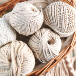 Handmade macrame braiding, background thread on a wooden Board top view | ASD Market Week