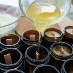 Pouring melted wax. Handmade soy candles with mica and wooden wi | ASD Market Week